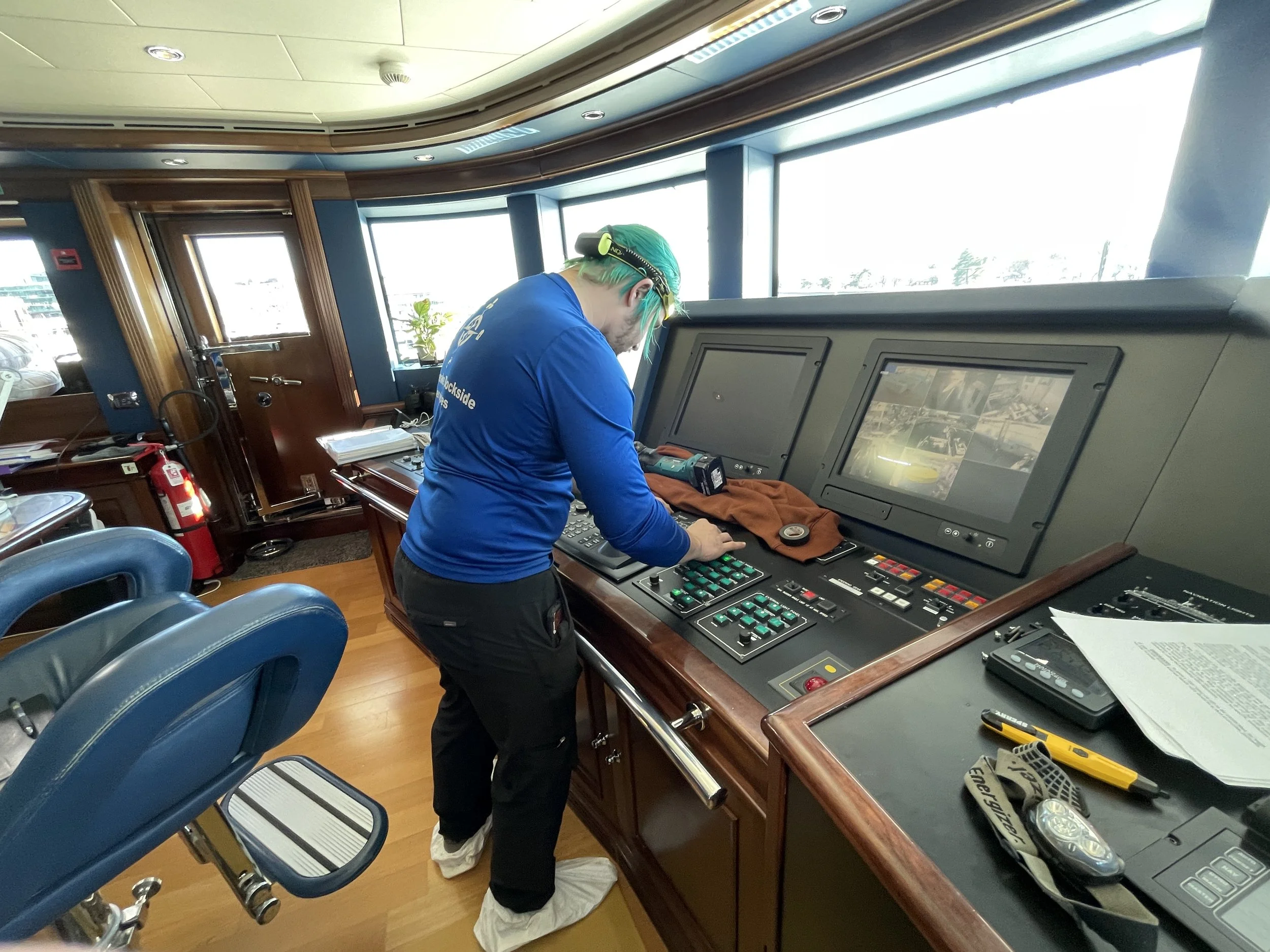 Technician working on pilot house electronics