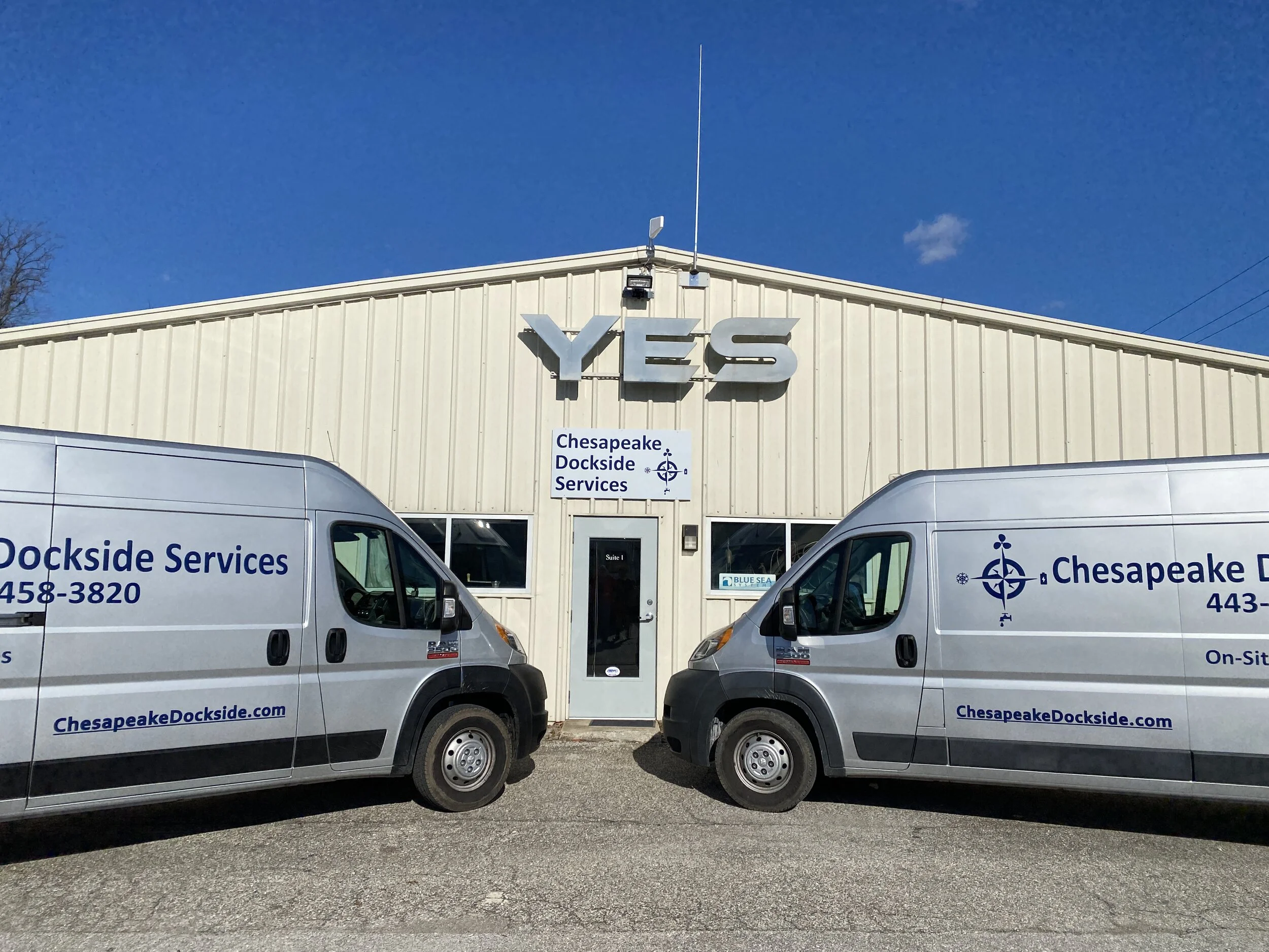 YES building with Chesapeake Dockside service trucks